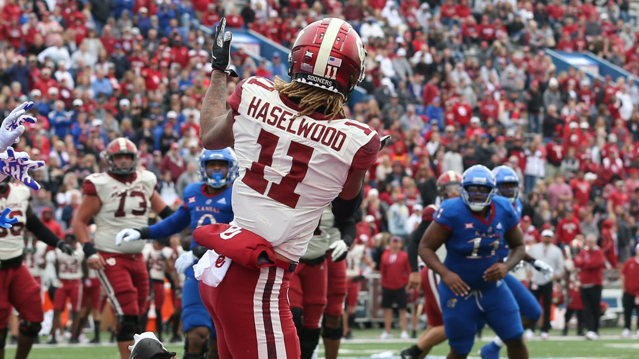 LAWRENCE, KS - OCTOBER 23: Oklahoma Sooners wide receiver Jadon Haselwood (11) makes a 5-yard touchdown catch in the third quarter of a Big 12 football game between the Oklahoma Sooners and Kansas Jayhawks on Oct 23, 2021 at Memorial Stadium in Lawrence, KS.