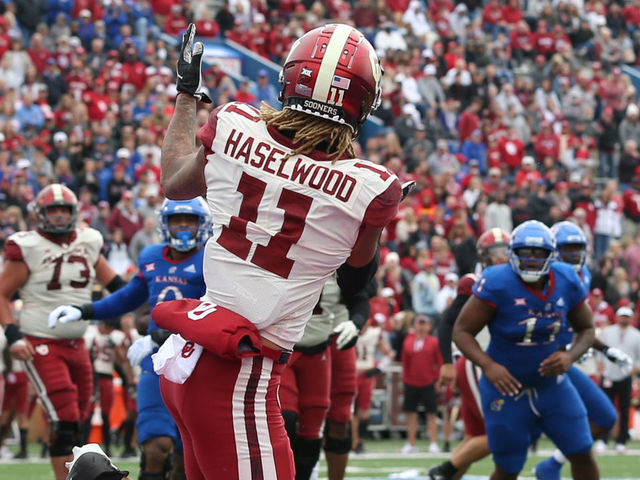 LAWRENCE, KS - OCTOBER 23: Oklahoma Sooners wide receiver Jadon Haselwood (11) makes a 5-yard touchdown catch in the third quarter of a Big 12 football game between the Oklahoma Sooners and Kansas Jayhawks on Oct 23, 2021 at Memorial Stadium in Lawrence, KS.