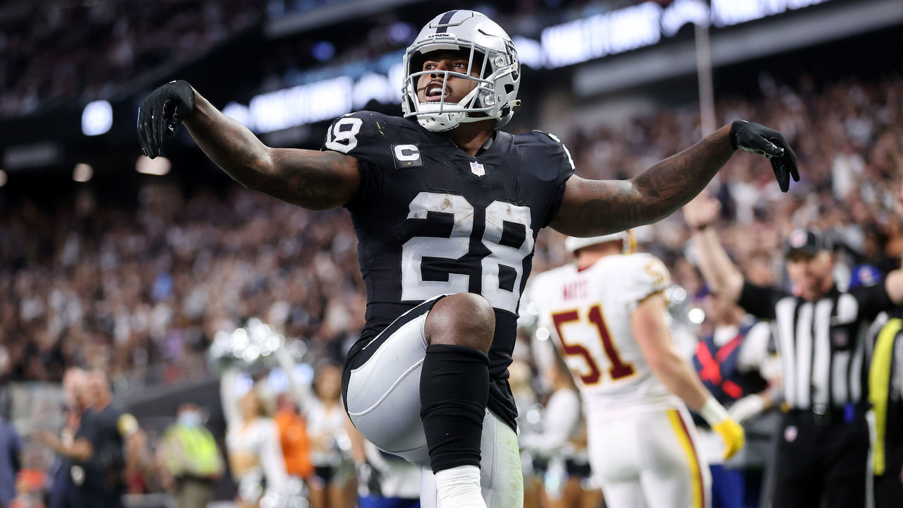 LAS VEGAS, NEVADA - DECEMBER 05: Josh Jacobs #28 of the Las Vegas Raiders celebrates after scoring a rushing touchdown against the Washington Football Team during the fourth quarter at Allegiant Stadium on December 05, 2021 in Las Vegas, Nevada.