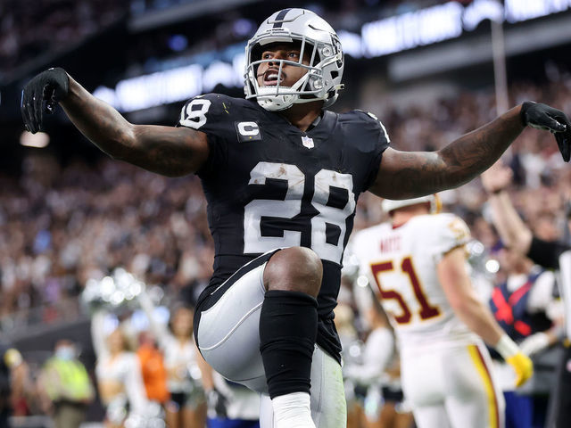 LAS VEGAS, NEVADA - DECEMBER 05: Josh Jacobs #28 of the Las Vegas Raiders celebrates after scoring a rushing touchdown against the Washington Football Team during the fourth quarter at Allegiant Stadium on December 05, 2021 in Las Vegas, Nevada.