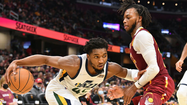 CLEVELAND, OHIO - DECEMBER 05: Donovan Mitchell #45 of the Utah Jazz drives to the basket around Darius Garland #10 of the Cleveland Cavaliers during the third quarter at Rocket Mortgage Fieldhouse on December 05, 2021 in Cleveland, Ohio. The Jazz defeated the Cavaliers 109-108. NOTE TO USER: User expressly acknowledges and agrees that, by downloading and/or using this photograph, user is consenting to the terms and conditions of the Getty Images License Agreement.