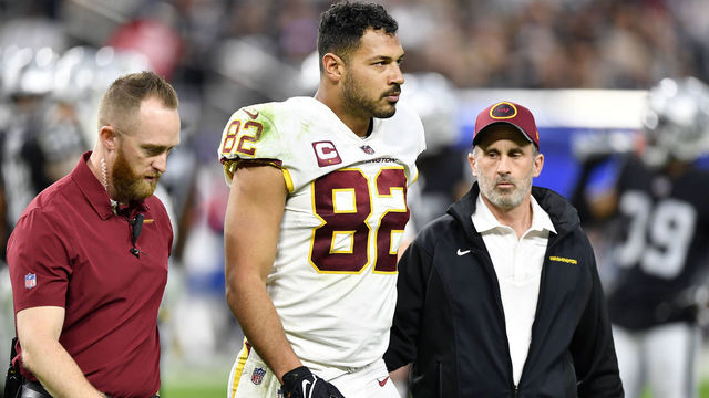 LAS VEGAS, NEVADA - DECEMBER 05: Logan Thomas #82 of the Washington Football Team walks off the field with team trainers after suffering an injury during the fourth quarter of the game between the Washington Football Team and the Las Vegas Raiders at Allegiant Stadium on December 05, 2021 in Las Vegas, Nevada.