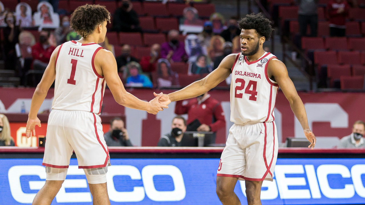 NORMAN, OK - JANUARY 30: Oklahoma Sooners guard Elijah Harkless (24) and Oklahoma Sooners forward Jalen Hill (1) slap hands after a play during the first half against the Alabama Crimson Tide on January 30, 2021 at Lloyd Noble Center in Norman Oklahoma.