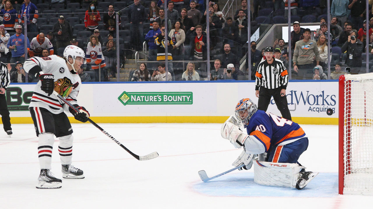 ELMONT, NEW YORK - DECEMBER 05: Patrick Kane #88 of the Chicago Blackhawks scores the game winning goal in the shootout against Semyon Varlamov #40 of the New York Islanders at the UBS Arena on December 05, 2021 in Elmont, New York. The Blackhawks defeated the Islanders 3-2 in the shootout.