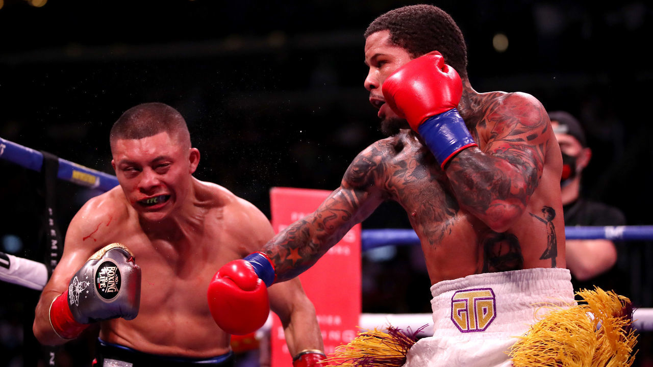 LOS ANGELES, CALIFORNIA - DECEMBER 05: Gervonta Davis (R) punches Isaac Cruz during their WBA World Lightweight Championship title bout at Staples Center on December 05, 2021 in Los Angeles, California.