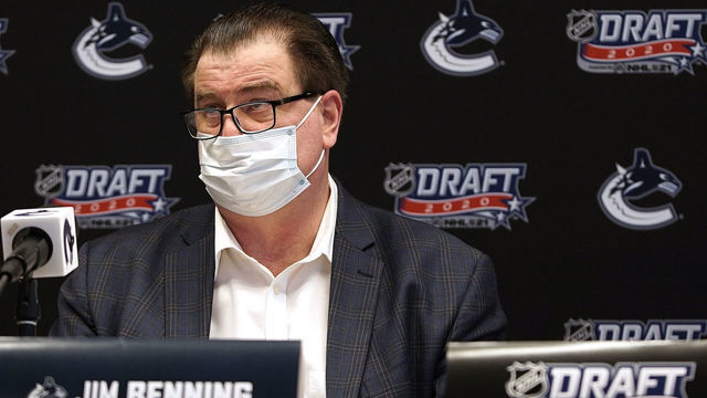 VANCOUVER, BC - OCTOBER 07: General manager Jim Benning of the Vancouver Canucks sits at the draft table during the rounds 2-7 of the 2020 NHL Entry Draft at Bell MTS Place on October 07, 2020 in Vancouver, British Columbia, Canada. The 2020 NHL Draft was held virtually due to the ongoing Coronavirus pandemic.