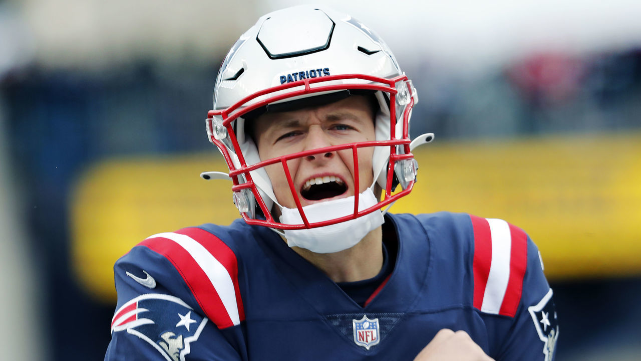 Foxborough, MA - November 28: New England Patriots quarterback Mac Jones howls to the fans in the south end zone as he comes out for pre game warmups. The New England Patriots host the Tennessee Titans in a regular season NFL football game at Gillette Stadium in Foxborough, MA on Nov. 28, 2021.