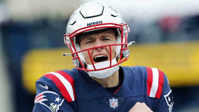 Foxborough, MA - November 28: New England Patriots quarterback Mac Jones howls to the fans in the south end zone as he comes out for pre game warmups. The New England Patriots host the Tennessee Titans in a regular season NFL football game at Gillette Stadium in Foxborough, MA on Nov. 28, 2021.