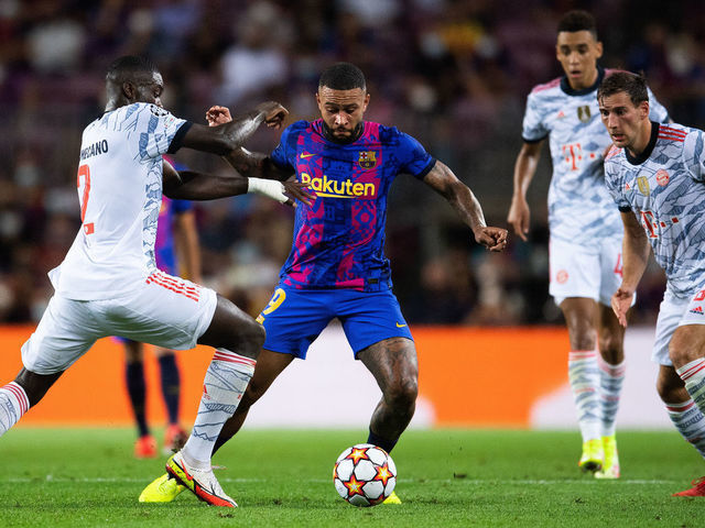 BARCELONA, SPAIN - SEPTEMBER 14: Memphis Depay of FC Barcelona competes for the ball with Dayot Upamecano and Leon Goretzka of Bayern München during the UEFA Champions League group E match between FC Barcelona and Bayern München at Camp Nou on September 14, 2021 in Barcelona, Spain.