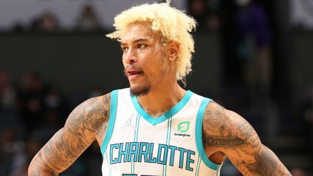 CHARLOTTE, NC - DECEMBER 6: Kelly Oubre Jr. #12 of the Charlotte Hornets looks on during the game against the Philadelphia 76ers on December 6, 2021 at Spectrum Center in Charlotte, North Carolina. Mandatory Copyright Notice: Copyright 2021 NBAE