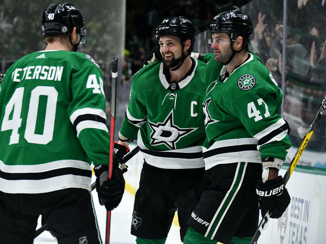 DALLAS, TX - DECEMBER 6: Jamie Benn #14 and Alexander Radulov #47 and Jacob Peterson #40 of the Dallas Stars celebrate a goal against the Arizona Coyotes at the American Airlines Center on December 6, 2021 in Dallas, Texas.