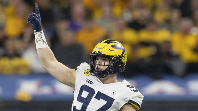INDIANAPOLIS, IN - DECEMBER 04: Michigan Wolverines defensive end Aidan Hutchinson (97) celebrates after a play during the Big Ten Championship Game between the Iowa Hawkeyes and the Michigan Wolverines on December 04, 2021, at Lucas Oil Stadium, in Indianapolis, IL.