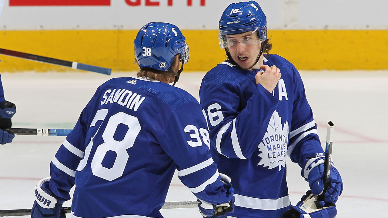 TORONTO, ON - MAY 6: Mitchell Marner #16 of the Toronto Maple Leafs gives direction to teammate Rasmus Sandin #38 late in action against the Montreal Canadiens during an NHL game at Scotiabank Arena on May 6, 2021 in Toronto, Ontario, Canada. The Maple Leafs defeated the Canadiens 5-2.