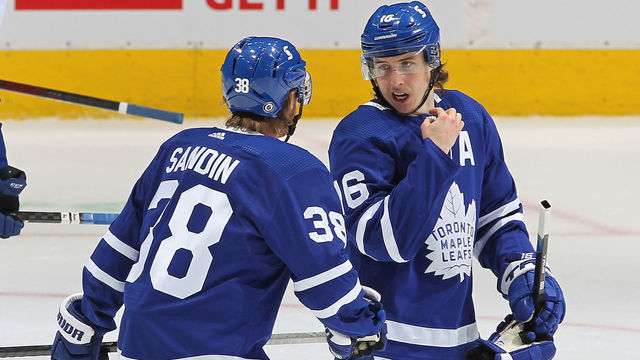 TORONTO, ON - MAY 6: Mitchell Marner #16 of the Toronto Maple Leafs gives direction to teammate Rasmus Sandin #38 late in action against the Montreal Canadiens during an NHL game at Scotiabank Arena on May 6, 2021 in Toronto, Ontario, Canada. The Maple Leafs defeated the Canadiens 5-2.