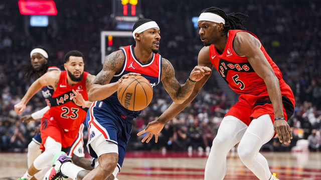 TORONTO, ON - DECEMBER 5: Bradley Beal #3 of the Washington Wizards drives against Precious Achiuwa #5 of the Toronto Raptors during the first half of their basketball game at the Scotiabank Arena on December 5, 2021 in Toronto, Ontario, Canada. NOTE TO USER: User expressly acknowledges and agrees that, by downloading and/or using this Photograph, user is consenting to the terms and conditions of the Getty Images License Agreement.