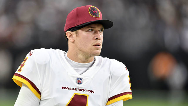 LAS VEGAS, NEVADA - DECEMBER 05: Taylor Heinicke #4 of the Washington Football Team looks on from the side lines during the half of the game against the Las Vegas Raiders at Allegiant Stadium on December 05, 2021 in Las Vegas, Nevada.