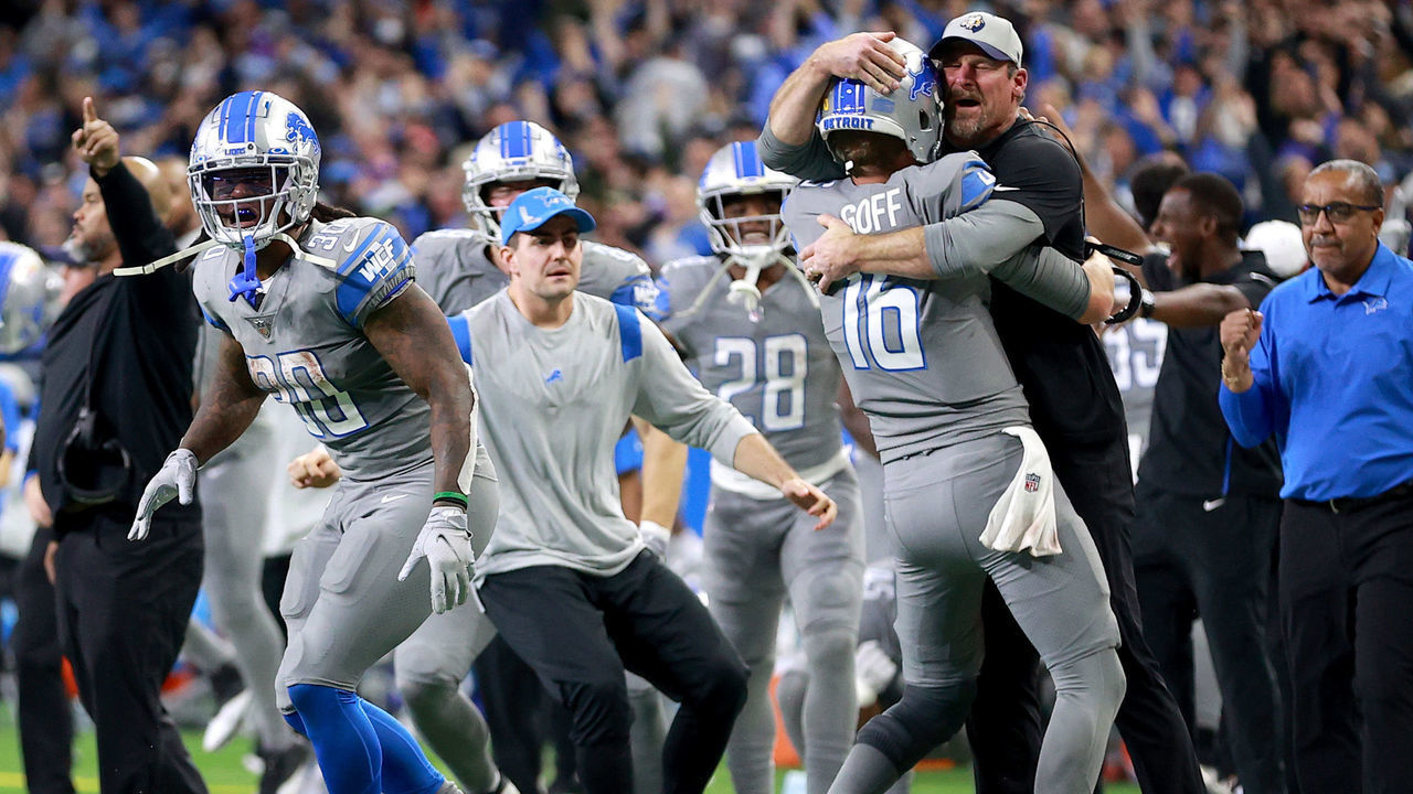 DETROIT, MICHIGAN - DECEMBER 05: Jared Goff #16 of the Detroit Lions celebrates with head coach Dan Campbell after defeating the Minnesota Vikings 29-27 to win their first game of the season at Ford Field on December 05, 2021 in Detroit, Michigan.