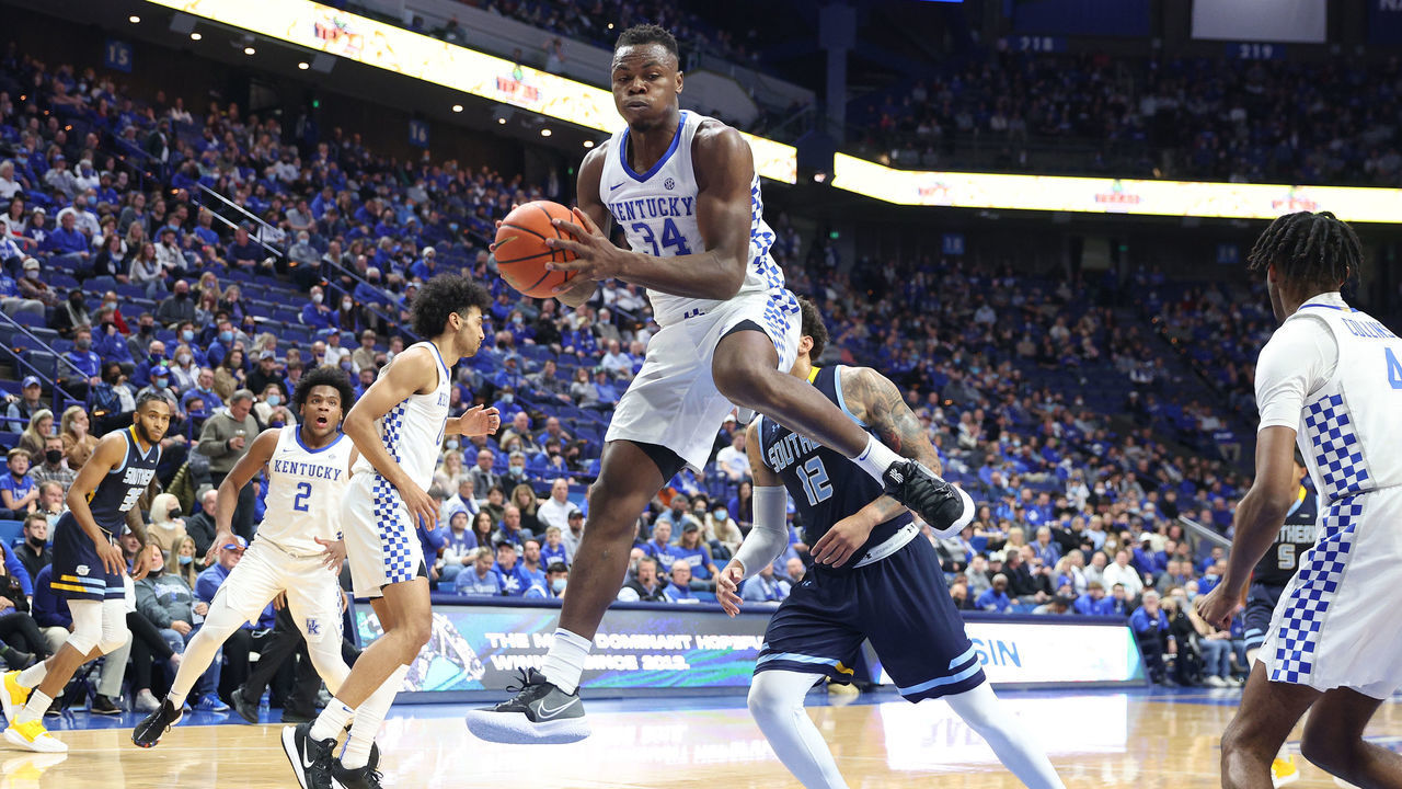 LEXINGTON, KENTUCKY - DECEMBER 07: Oscar Tshiebwe #34 of the Kentucky Wildcats grabs a rebound against the Southern Jaguars at Rupp Arena on December 07, 2021 in Lexington, Kentucky.