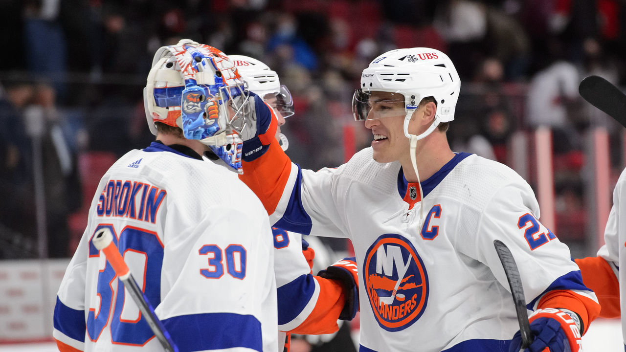 OTTAWA, ON - DECEMBER 7: Anders Lee #27 and Ilya Sorokin #30 of the New York Islanders celebrate a 5-3 win over the Ottawa Senators at Canadian Tire Centre on December 7, 2021 in Ottawa, Ontario, Canada.