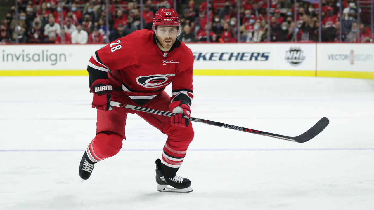 RALEIGH, NC - OCTOBER 14: Ian Cole #28 of the Carolina Hurricanes skates for position on the ice during his 600th career NHL game against the Toronto Maple Leafs on October 25, 2021 at PNC Arena in Raleigh, North Carolina.