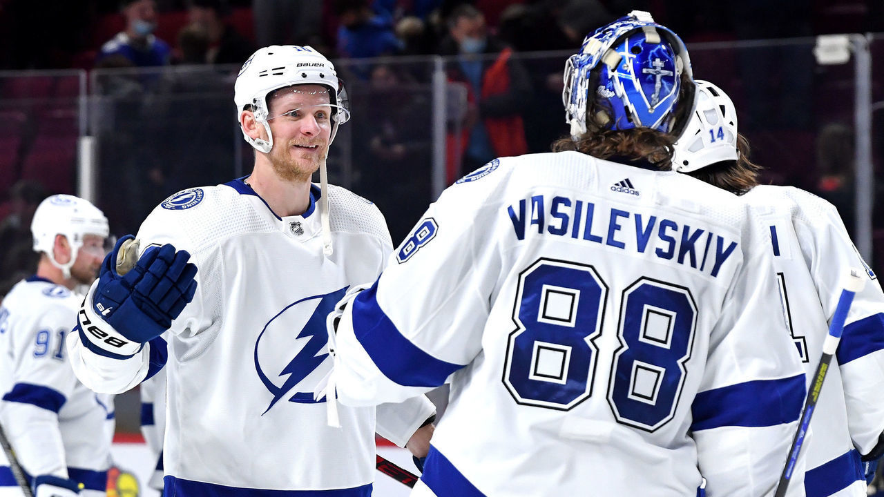 MONTREAL, QC - DECEMBER 7: Corey Perry #10 celebrates with goalie Andrei Vasilevskiy #88 of the Tampa Bay Lightning after defeating the Montreal Canadiens in the NHL game at the Bell Centre on December 7, 2021 in Montreal, Quebec, Canada.
