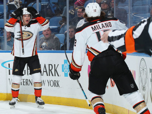 BUFFALO, NY - DECEMBER 7: Trevor Zegras #46 reacts to his behind the net pass assisting on a second period goal by Sonny Milano #12 of the Anaheim Ducks during an NHL game against the Buffalo Sabres on December 7, 2021 at KeyBank Center in Buffalo, New York.