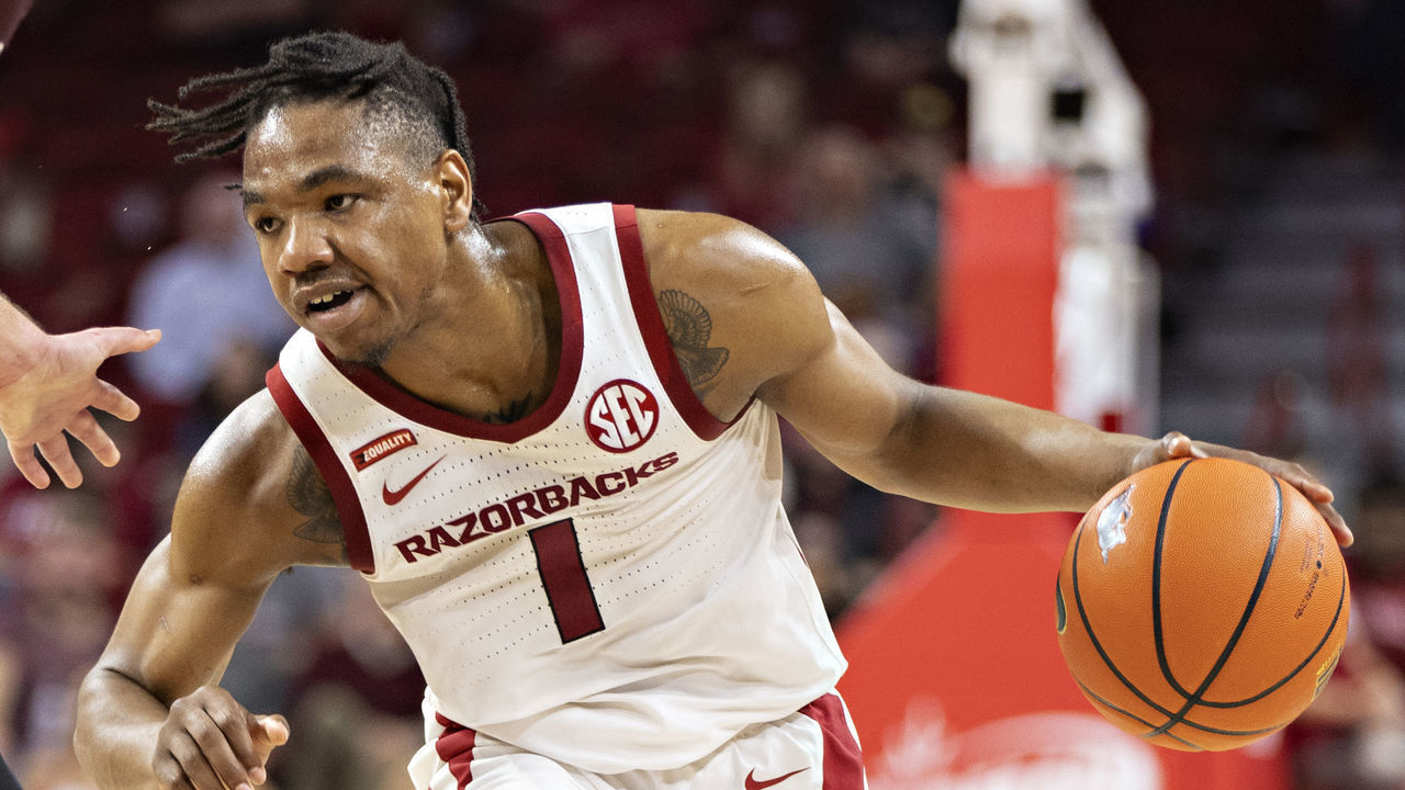 FAYETTEVILLE, ARKANSAS - DECEMBER 04: JD Notae #1 of the Arkansas Razorbacks looks to drive during a game against the Little Rock Trojans at Bud Walton Arena on December 04, 2021 in Fayetteville, Arkansas. The Razorbacks defeated the Trojans 93-78.