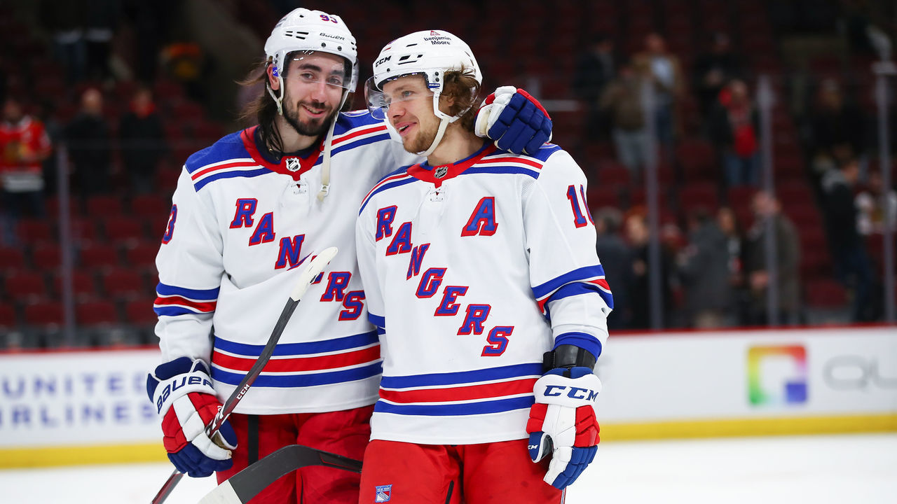 CHICAGO, IL - DECEMBER 07: New York Rangers Center Mika Zibanejad (93) and New York Rangers Left Wing Artemi Panarin (10) celebrate after a game between the Chicago Blackhawks and the New York Rangers on December 7, 2021 at the United Center in Chicago, IL.