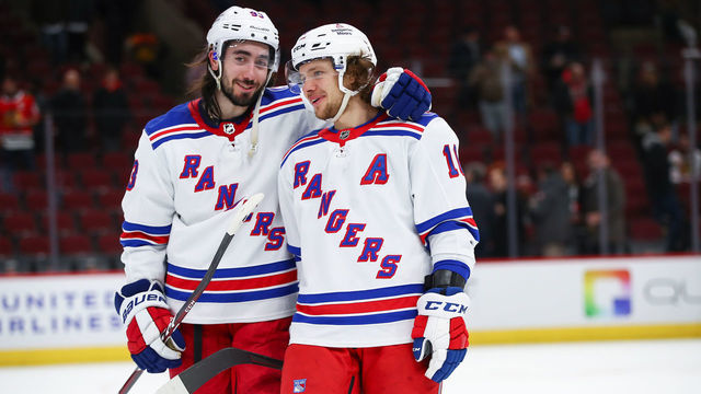 CHICAGO, IL - DECEMBER 07: New York Rangers Center Mika Zibanejad (93) and New York Rangers Left Wing Artemi Panarin (10) celebrate after a game between the Chicago Blackhawks and the New York Rangers on December 7, 2021 at the United Center in Chicago, IL.