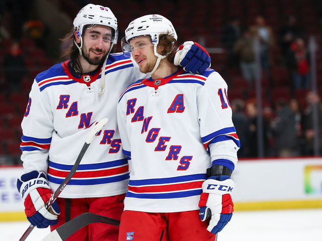 CHICAGO, IL - DECEMBER 07: New York Rangers Center Mika Zibanejad (93) and New York Rangers Left Wing Artemi Panarin (10) celebrate after a game between the Chicago Blackhawks and the New York Rangers on December 7, 2021 at the United Center in Chicago, IL.