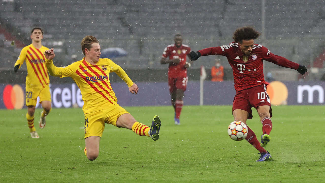 MUNICH, GERMANY - DECEMBER 08: Leroy Sané of Muenchen shots past Frenkie de Jong of Barcelona as he scores the second goal during the UEFA Champions League group E match between FC Bayern München and FC Barcelona at Football Arena Munich on December 08, 2021 in Munich, Germany.