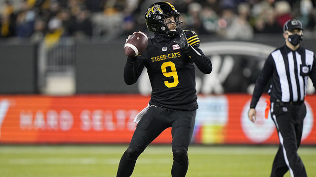 HAMILTON, ON - NOVEMBER 20: Dane Evans #9 of the Hamilton Tiger-Cats goes to pass the football against the Saskatchewan Roughriders at Tim Hortons Field on November 20, 2021 in Hamilton, Canada.