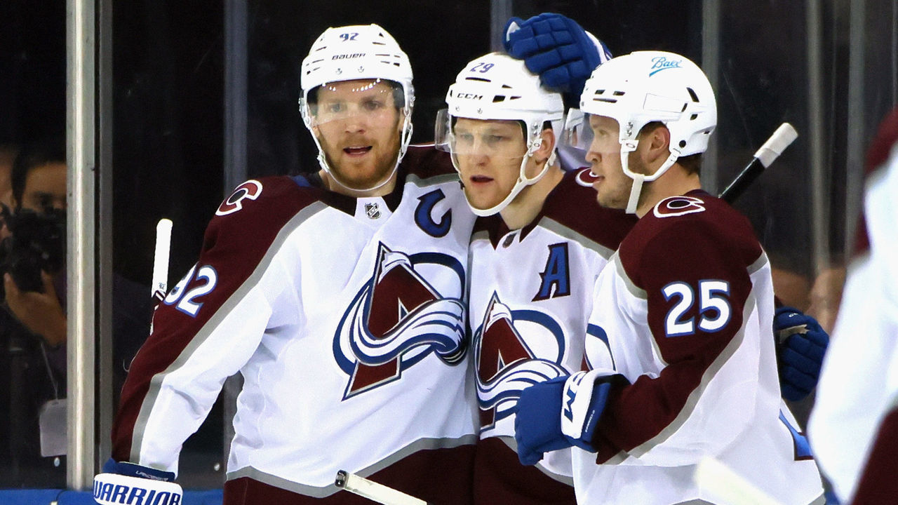 NEW YORK, NEW YORK - DECEMBER 08: (L-R) Gabriel Landeskog #92, Nathan MacKinnon #29 and Logan O'Connor #25 of the Colorado Avalanche celebrate MacKinnon's second period goal against the New York Rangers at Madison Square Garden on December 08, 2021 in New York City.