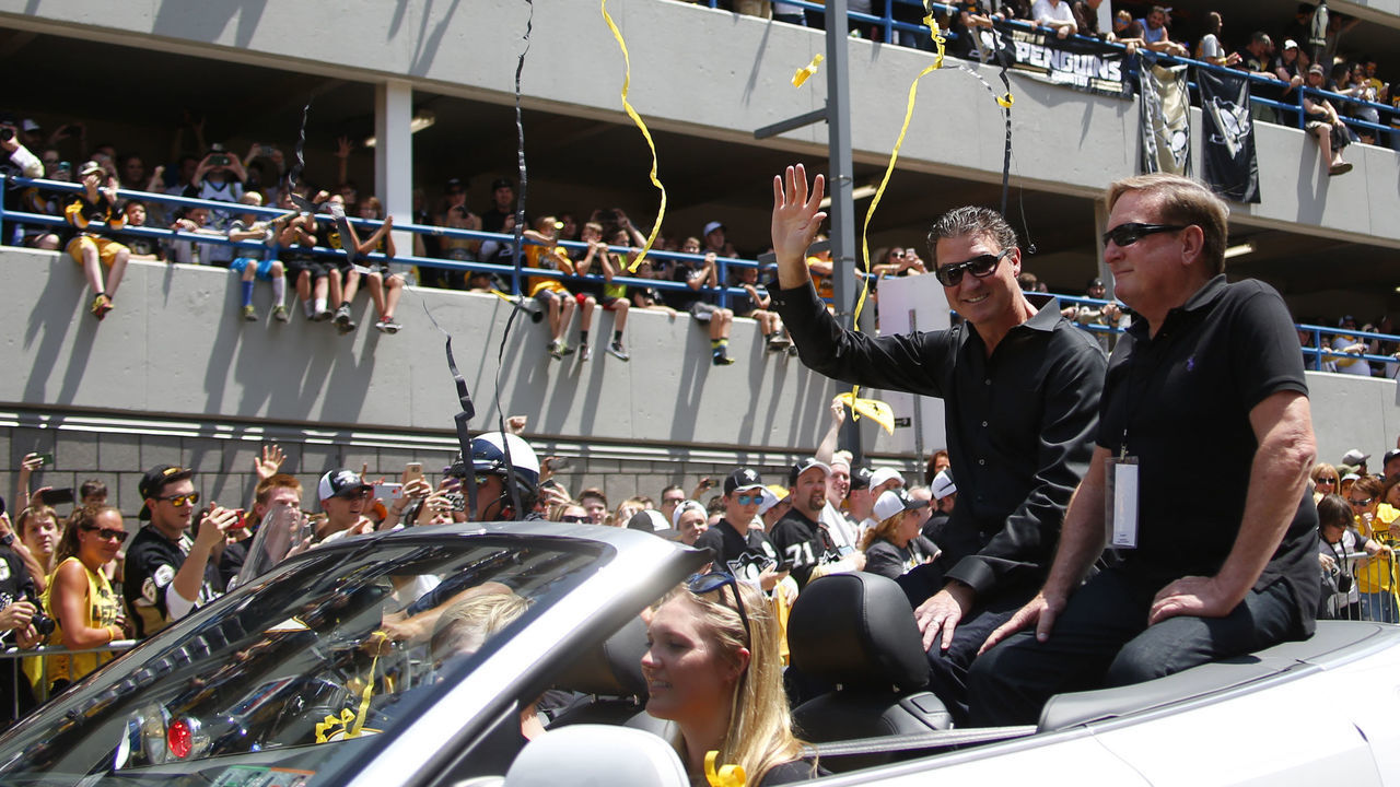 PITTSBURGH, PA - JUNE 15: Mario Lemieux and Ron Burkle celebrate during the Victory Parade and Rally on June 15, 2016 in Pittsburgh, Pennsylvania.