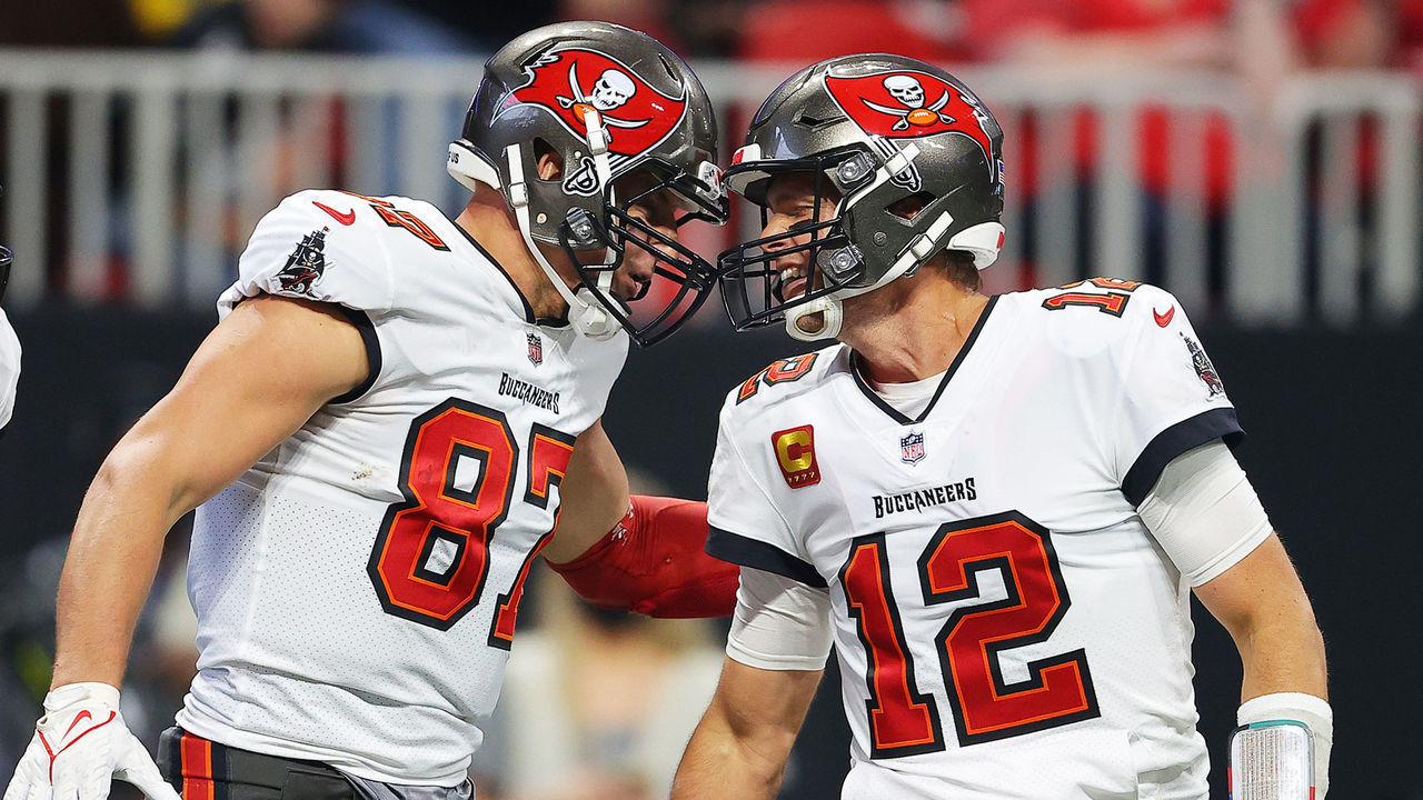 ATLANTA, GEORGIA - DECEMBER 05: (EDITOR'S NOTE: Alternate crop) Rob Gronkowski #87 of the Tampa Bay Buccaneers celebrates his touchdown against the Atlanta Falcons with teammate Tom Brady #12 during the second quarter at Mercedes-Benz Stadium on December 05, 2021 in Atlanta, Georgia.