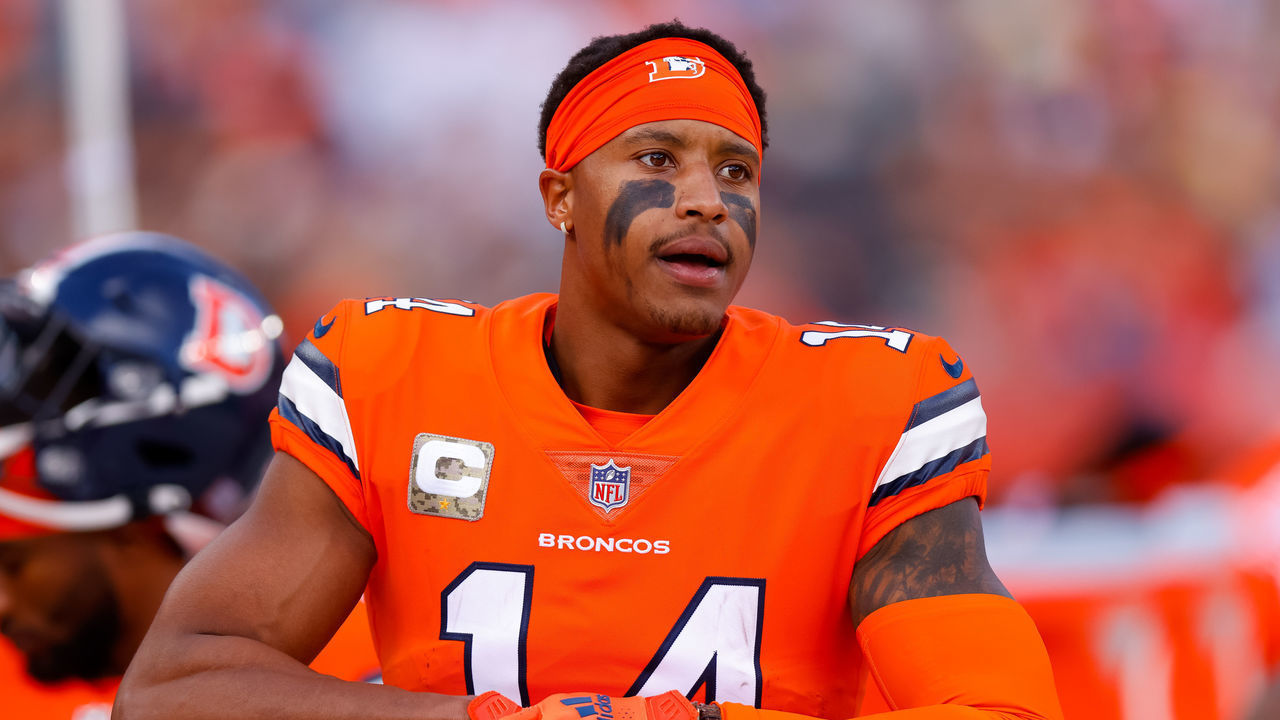DENVER, CO - NOVEMBER 14: Wide receiver Courtland Sutton #14 of the Denver Broncos adjusts his gloves on the sidelines during the first half against the Philadelphia Eagles at Empower Field at Mile High on November 14, 2021 in Denver, Colorado.