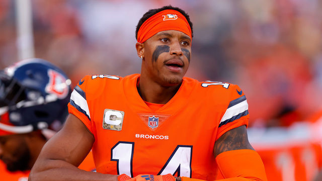DENVER, CO - NOVEMBER 14: Wide receiver Courtland Sutton #14 of the Denver Broncos adjusts his gloves on the sidelines during the first half against the Philadelphia Eagles at Empower Field at Mile High on November 14, 2021 in Denver, Colorado.
