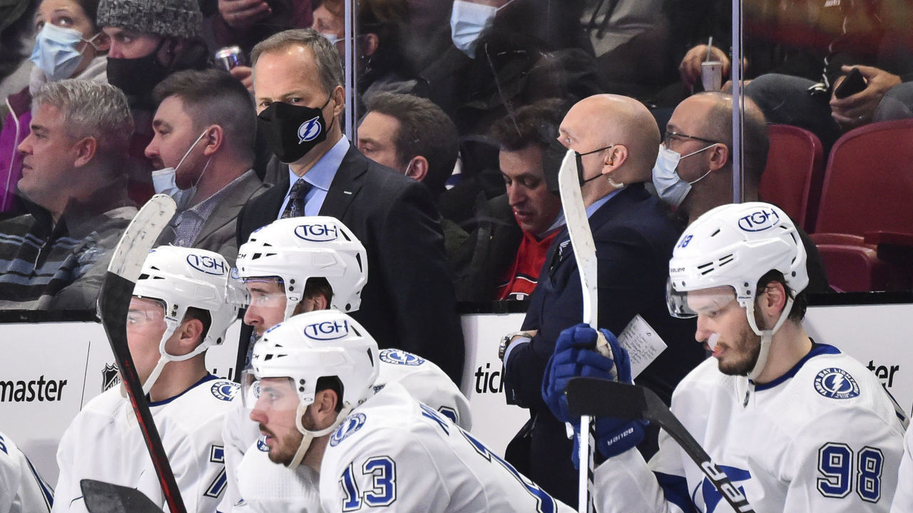 MONTREAL, QC - DECEMBER 07: Head coach of the Tampa Bay Lightning Jon Cooper handles bench duties during the second period against the Montreal Canadiens at Centre Bell on December 7, 2021 in Montreal, Canada. The Tampa Bay Lightning defeated the Montreal Canadiens 3-2.