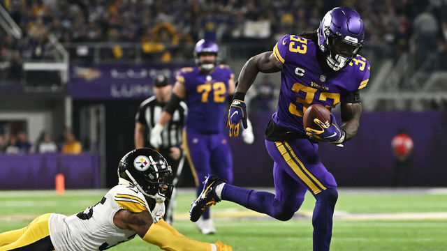 MINNEAPOLIS, MINNESOTA - DECEMBER 09: Dalvin Cook #33 of the Minnesota Vikings carries the ball during the third quarter against the Pittsburgh Steelers at U.S. Bank Stadium on December 09, 2021 in Minneapolis, Minnesota.