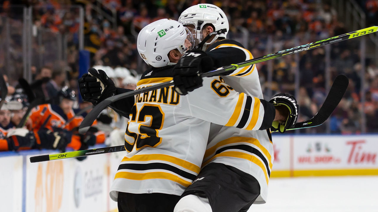 EDMONTON, AB - DECEMBER 09: Brad Marchand #63 and Patrice Bergeron #37 of the Boston Bruins celebrate a goal against the Edmonton Oilers during the first period at Rogers Place on December 9, 2021 in Edmonton, Canada.