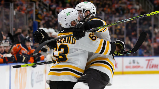 EDMONTON, AB - DECEMBER 09: Brad Marchand #63 and Patrice Bergeron #37 of the Boston Bruins celebrate a goal against the Edmonton Oilers during the first period at Rogers Place on December 9, 2021 in Edmonton, Canada.