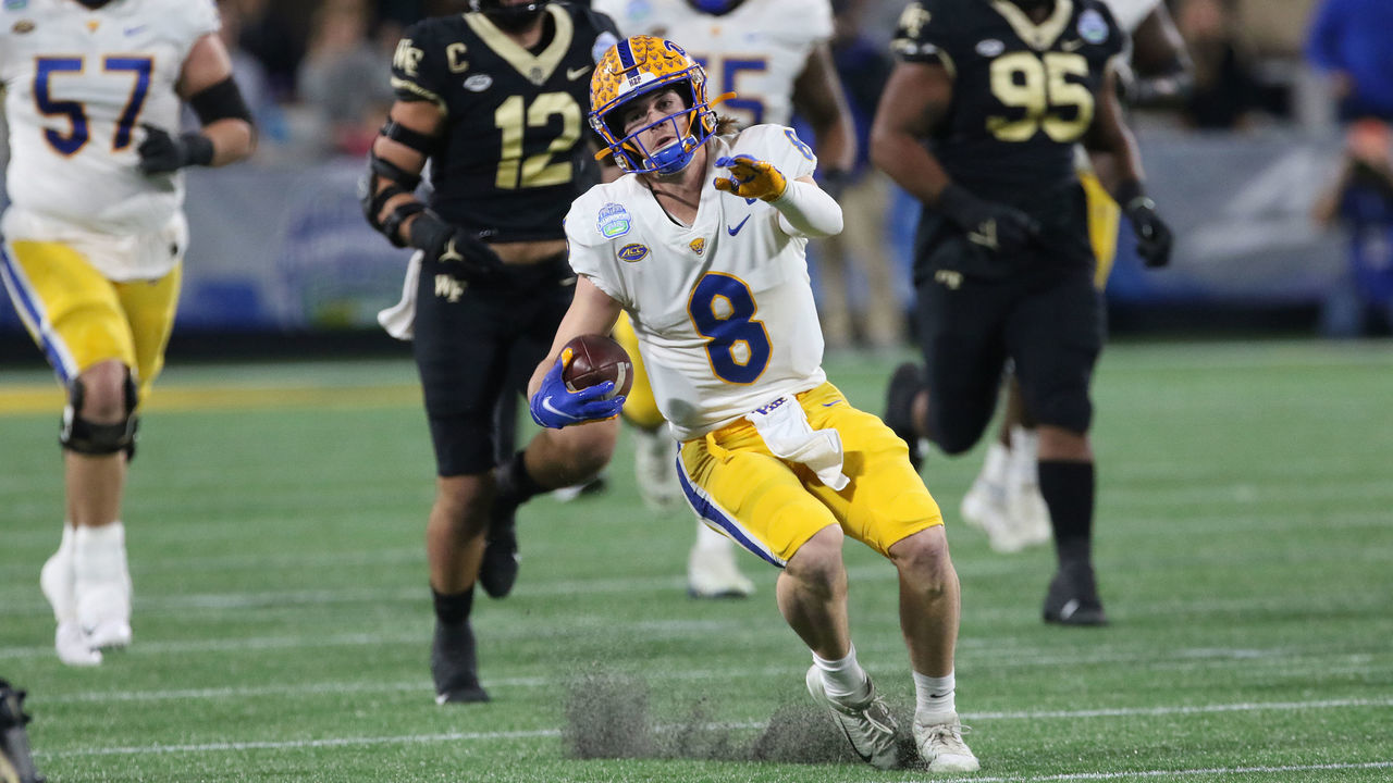 CHARLOTTE, NC - DECEMBER 04: Kenny Pickett (8) quarterback of Pitt. fakes a slide on his way to score a touchdown during the ACC Football Championship game between the Pitt Panthers and the Wake Forest Demon Deacons on December 4, 2021, at Bank of America Stadium in Charlotte, N.C.