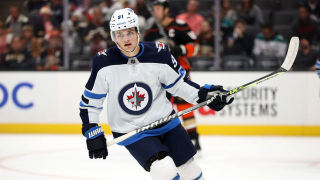 ANAHEIM, CALIFORNIA - OCTOBER 13: Cole Perfetti #91 of the Winnipeg Jets skates against the Anaheim Ducks in the first period at Honda Center on October 13, 2021 in Anaheim, California.