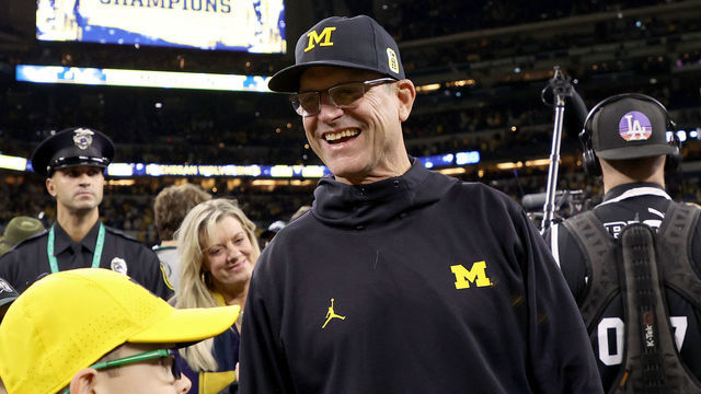 INDIANAPOLIS, INDIANA - DECEMBER 04: Head coach Jim Harbaugh of the Michigan Wolverines celebrates after defeating the Iowa Hawkeyes 42-3 to win the Big Ten Championship game at Lucas Oil Stadium on December 04, 2021 in Indianapolis, Indiana.