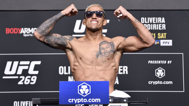 LAS VEGAS, NEVADA - DECEMBER 10: Charles Oliveira of Brazil poses on the scale during the UFC 269 official weigh-in at UFC APEX on December 10, 2021 in Las Vegas, Nevada.