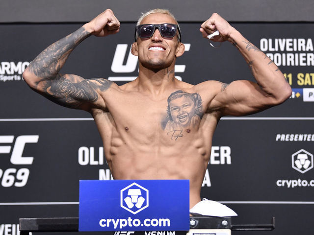 LAS VEGAS, NEVADA - DECEMBER 10: Charles Oliveira of Brazil poses on the scale during the UFC 269 official weigh-in at UFC APEX on December 10, 2021 in Las Vegas, Nevada.