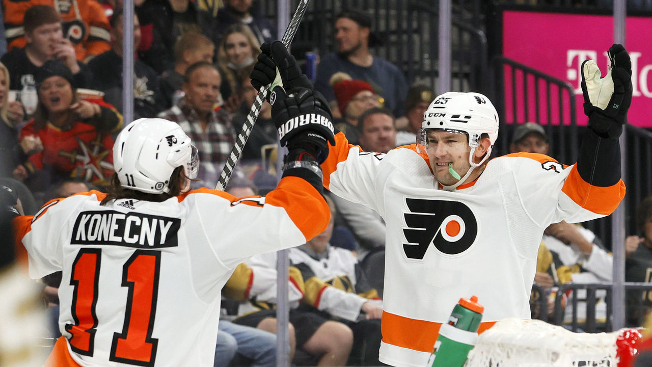 LAS VEGAS, NEVADA - DECEMBER 10: Travis Konecny #11 and James van Riemsdyk #25 of the Philadelphia Flyers celebrate after Konecny assisted van Riemsdyk on a third-period power-play goal against the Vegas Golden Knights during their game at T-Mobile Arena on December 10, 2021 in Las Vegas, Nevada. The Flyers defeated the Golden Knights 4-3.
