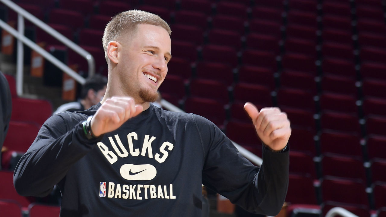 HOUSTON, TX - DECEMBER 10: George Hill #3 and Donte DiVincenzo #0 of the Milwaukee Bucks talk together before the game against the Houston Rockets on December 10, 2021 at the Toyota Center in Houston, Texas. Mandatory Copyright Notice: Copyright 2021 NBAE
