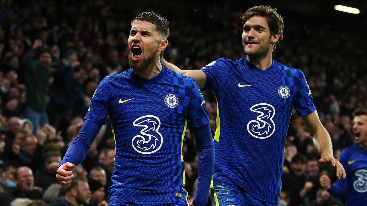 LONDON, ENGLAND - DECEMBER 11: Jorginho of Chelsea celebrates with Marcos Alonso after scoring their side's second goal during the Premier League match between Chelsea and Leeds United at Stamford Bridge on December 11, 2021 in London, England.