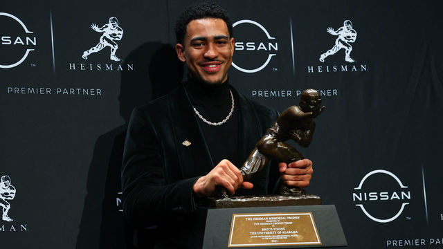NEW YORK, NY - DECEMBER 11: Alabama quarterback Bryce Young poises with the trophy after winning the Heisman Trophy at the press conference at the Marriott Marquis in New York on December 11, 2021 in New York City, NY.